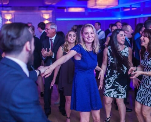 A Corporate Party With a Man and a Woman Dancing