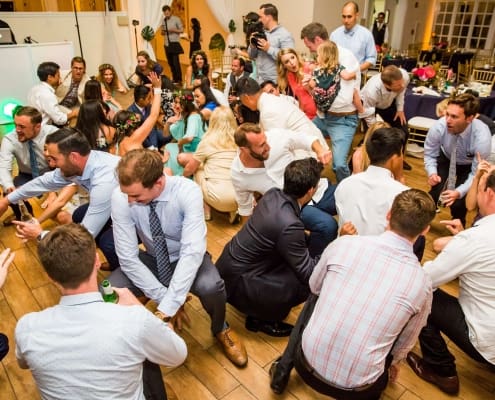 A Group of People Crouched on the Floor