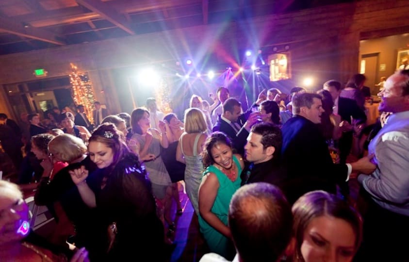 A Group of People Dancing in a Disco Setting