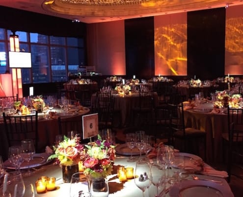 A Dark Venue Setting With Orange Themed Lights