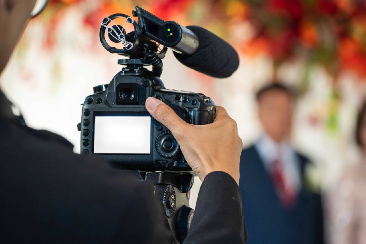 A Videographer shooting a Video of an Event