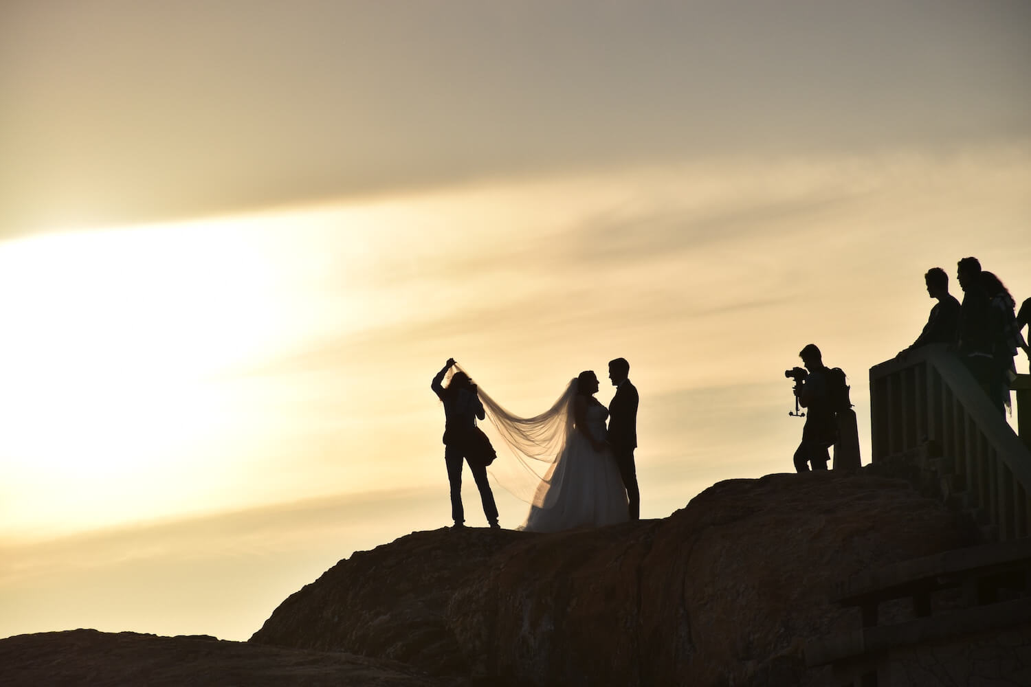 A Camera Crew Taking Pictures During Dusk