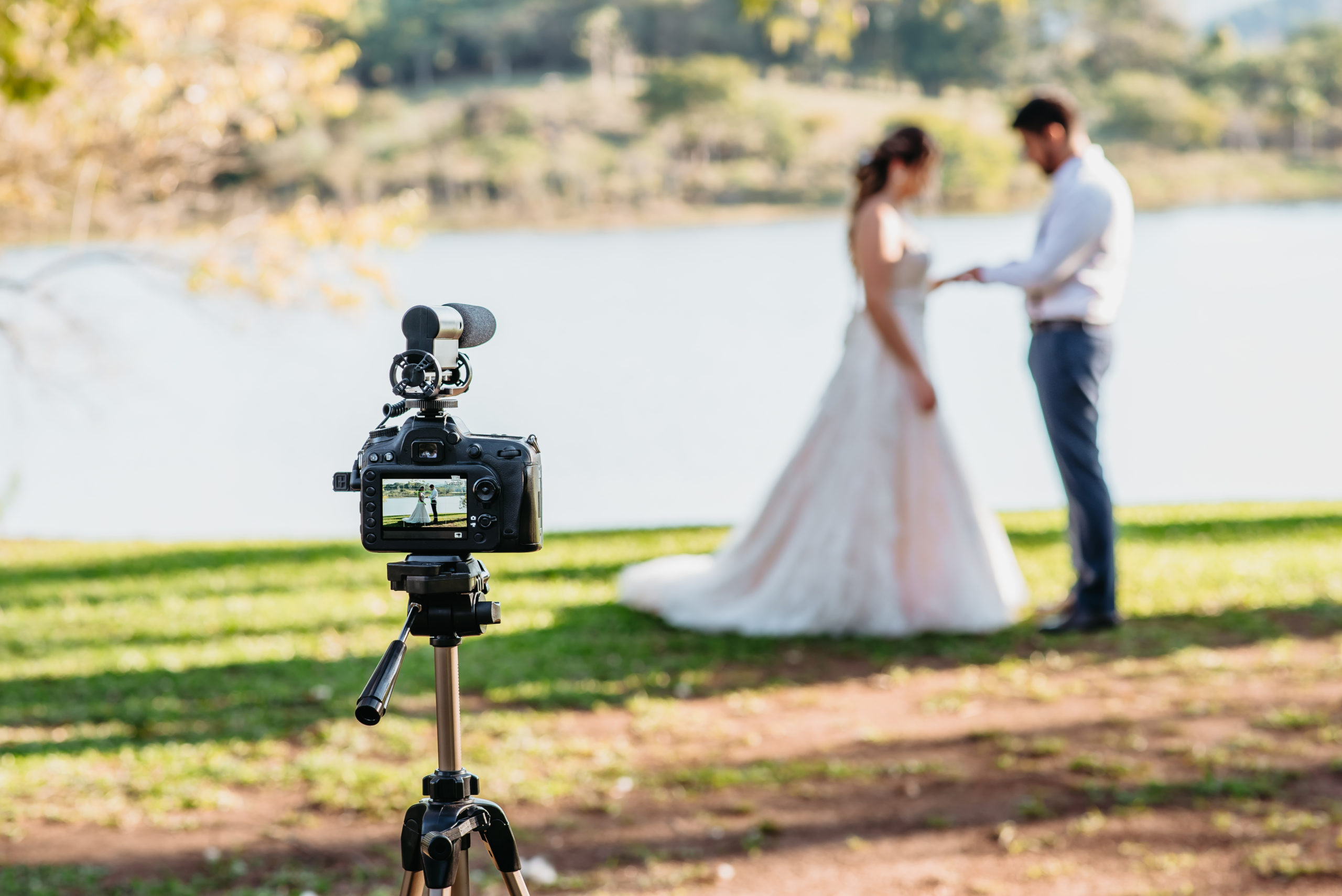 A Camera Capturing a Couple Holding Hands