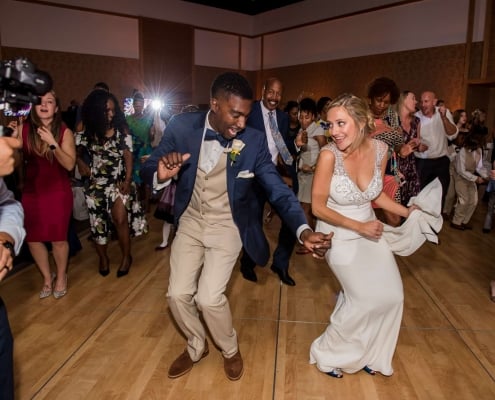 A Bride and Groom Dancing on a Wood Stage Copy